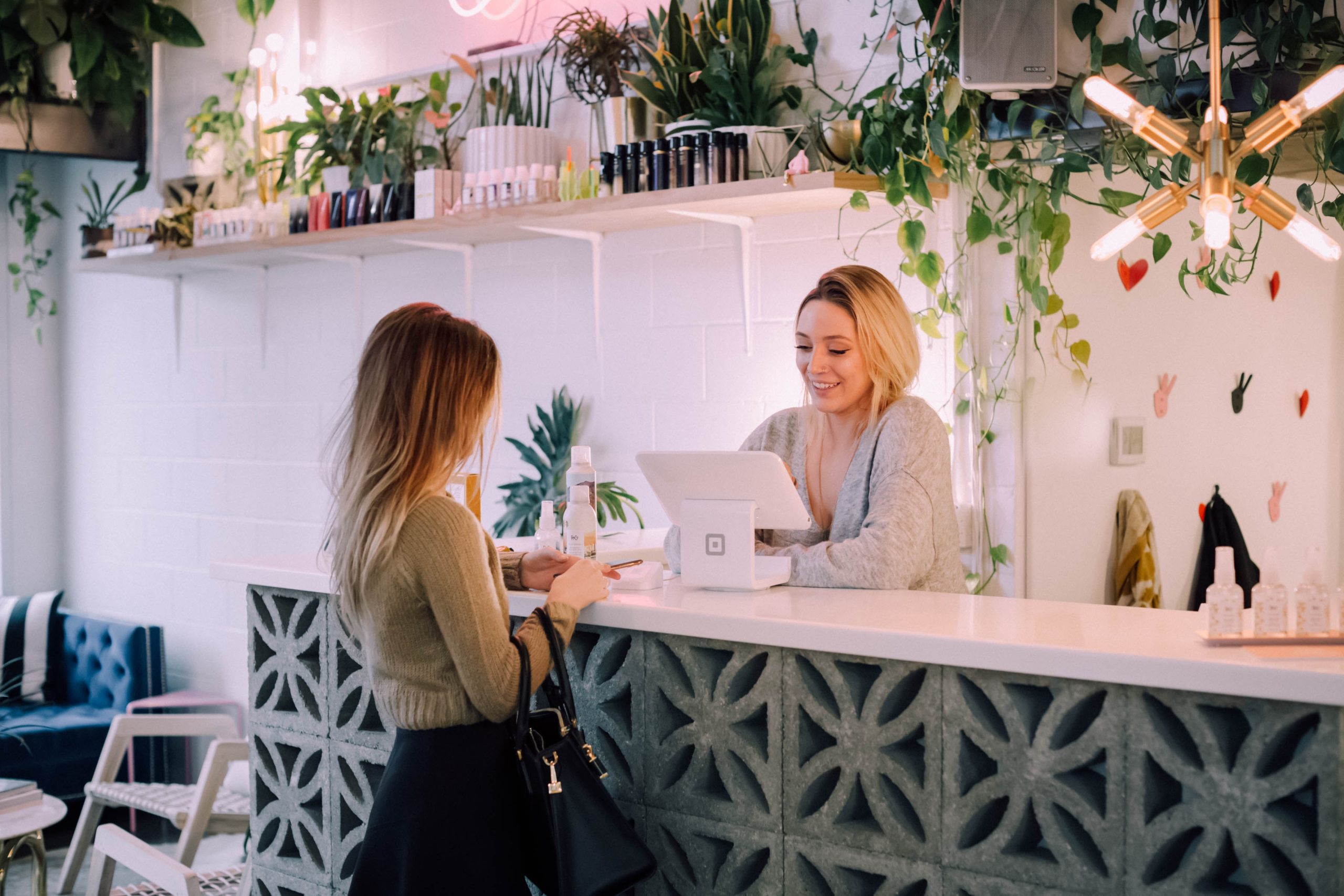 Photo of a customer and a shop assistant picking up her order